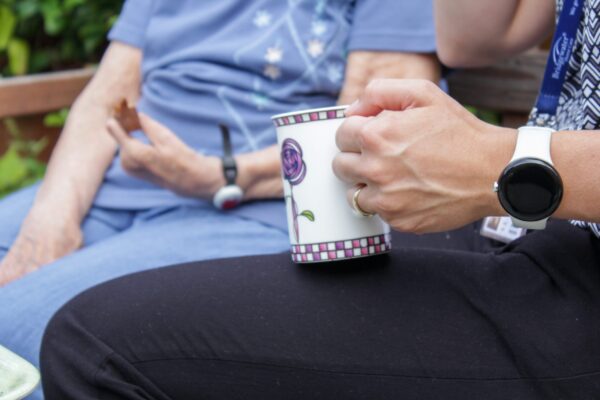 home-care-help-drinking-tea-with-patient