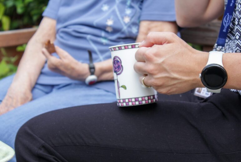 home-care-help-drinking-tea-with-patient