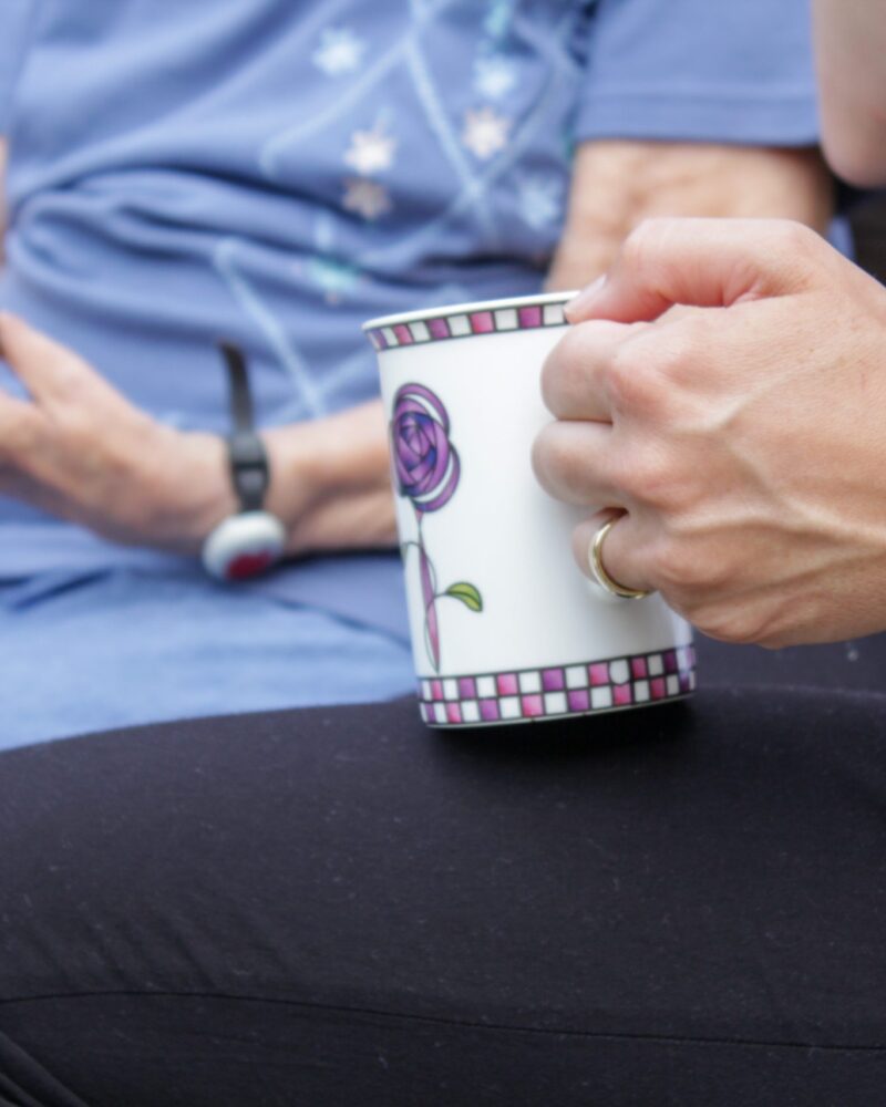 home-care-help-drinking-tea-with-patient