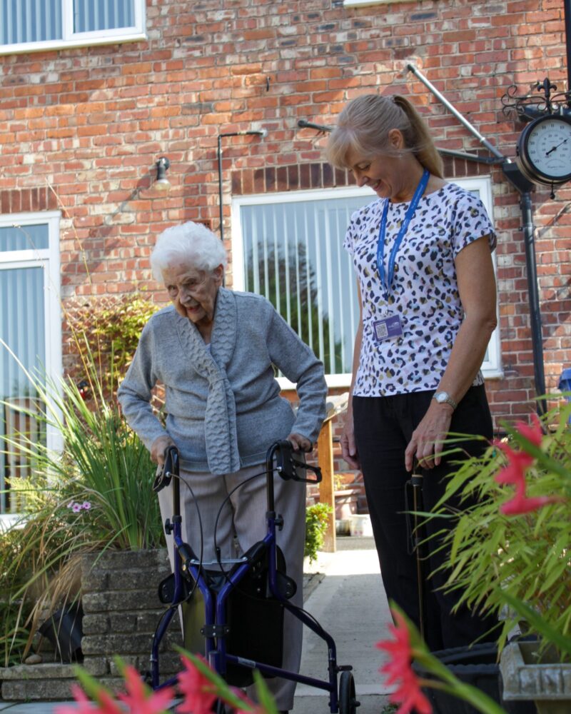 home-care-helper-in-garden-with-patient